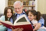 senior and children reading